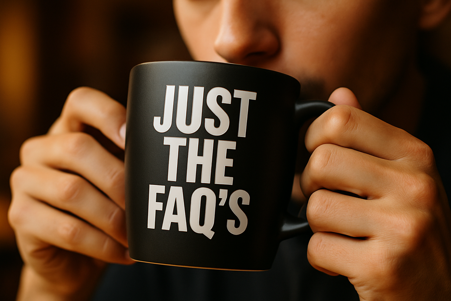 someone drinking from a matte black coffee cup with the words JUST THE FAQ'S in white using Bebas Neue font